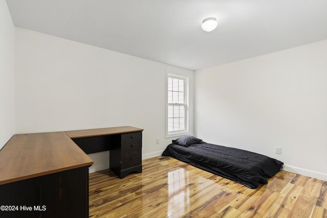 bedroom with light hardwood / wood-style flooring