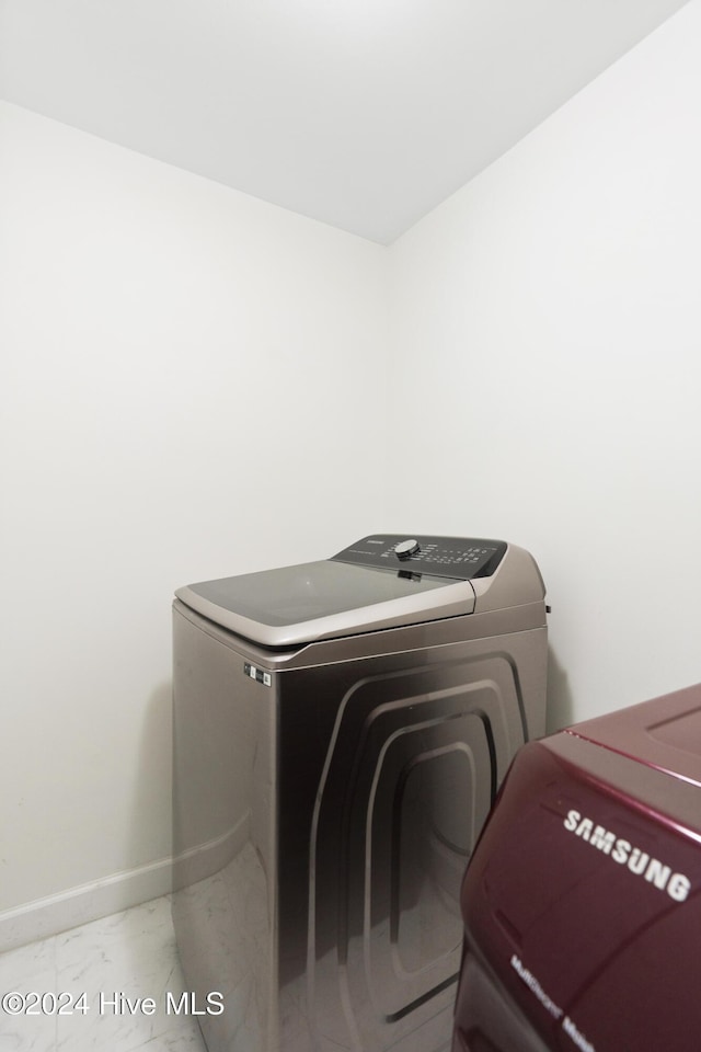 laundry area featuring separate washer and dryer