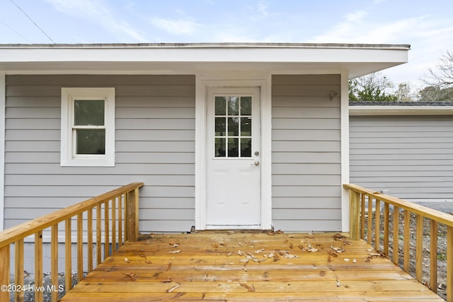 entrance to property featuring a deck