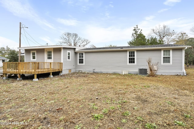 back of house featuring a wooden deck