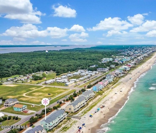 drone / aerial view featuring a water view and a beach view