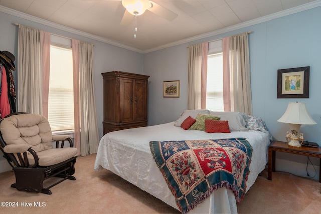 bedroom with ceiling fan, light colored carpet, and ornamental molding