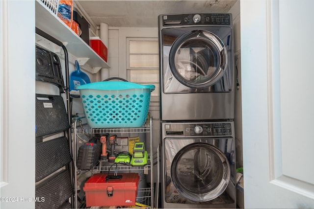 laundry room with stacked washer / dryer