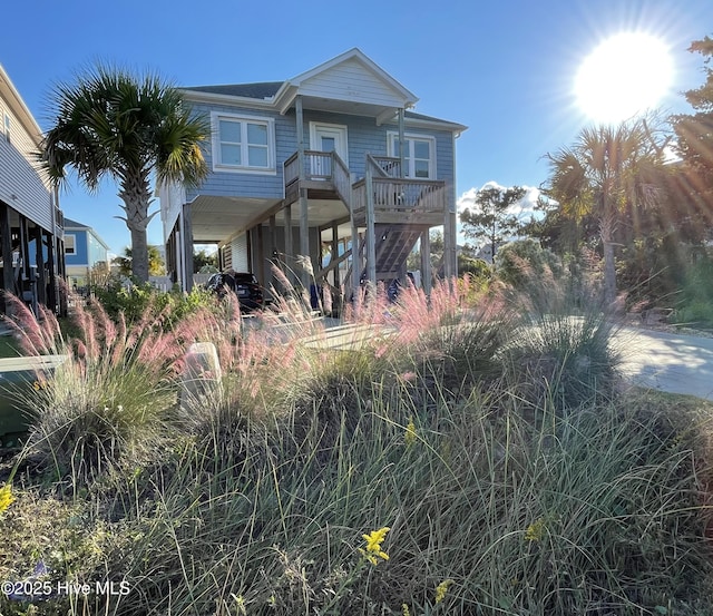 beach home featuring stairway