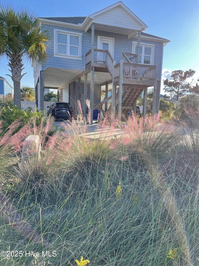 view of front of home with a carport