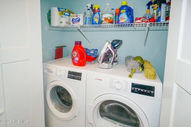 laundry area with washing machine and dryer