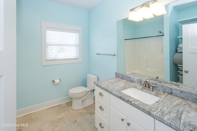 bathroom with walk in shower, baseboards, vanity, and toilet