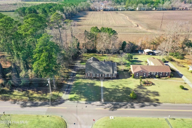 birds eye view of property with a rural view