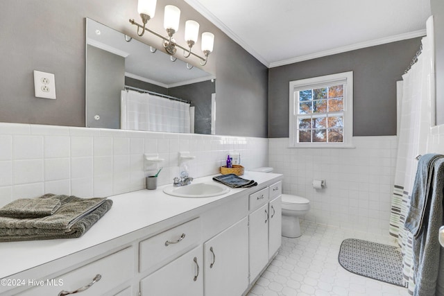 bathroom featuring vanity, toilet, tile walls, and crown molding