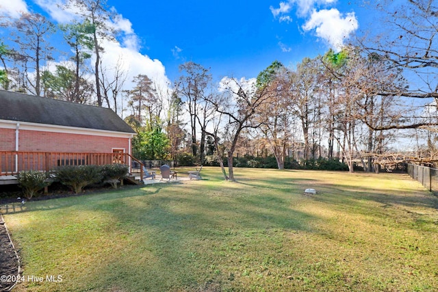 view of yard featuring a deck