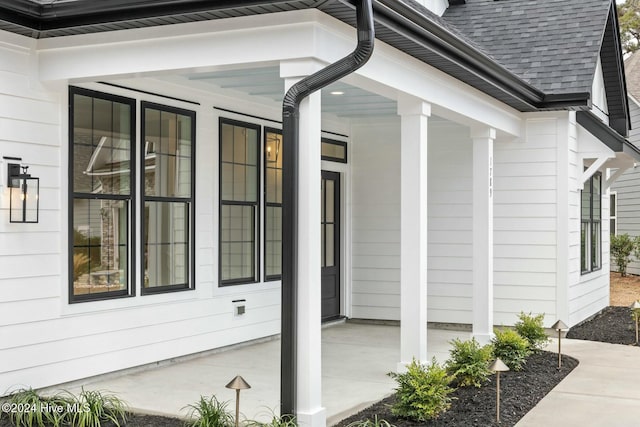 view of property exterior featuring covered porch