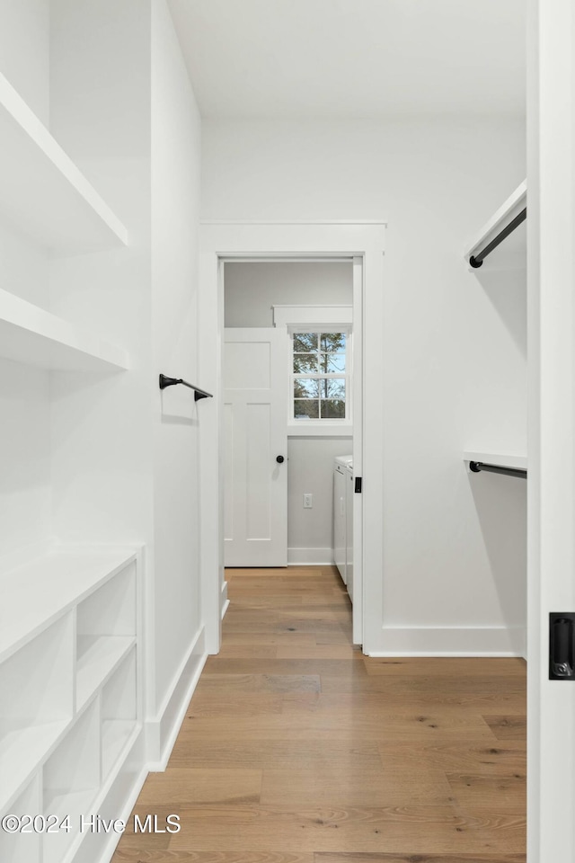 interior space with washer and dryer and light wood-type flooring