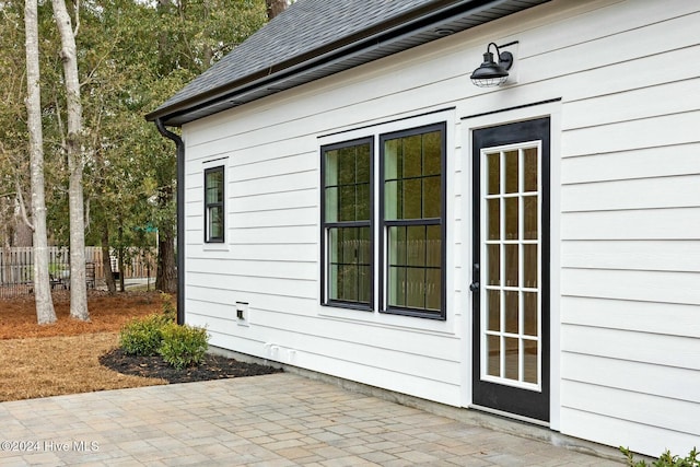 view of side of property with a patio