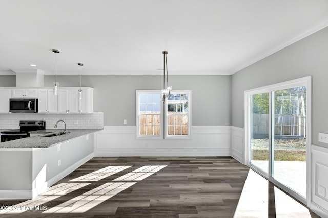 kitchen with kitchen peninsula, white cabinetry, hanging light fixtures, and stainless steel appliances