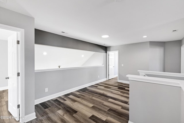 spare room featuring dark hardwood / wood-style flooring