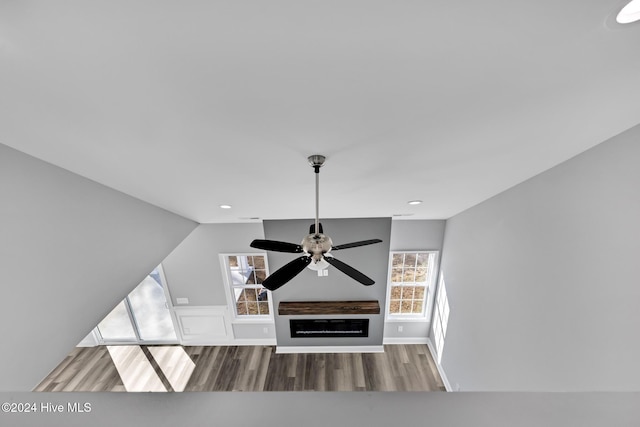 unfurnished living room with a fireplace and hardwood / wood-style floors