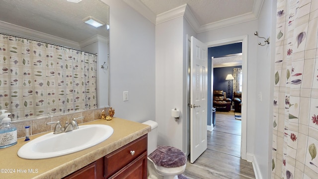 bathroom featuring walk in shower, wood-type flooring, a textured ceiling, toilet, and vanity