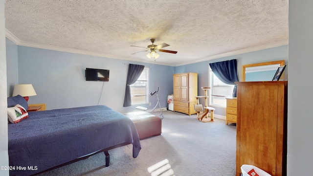 carpeted bedroom featuring a textured ceiling, ceiling fan, and crown molding