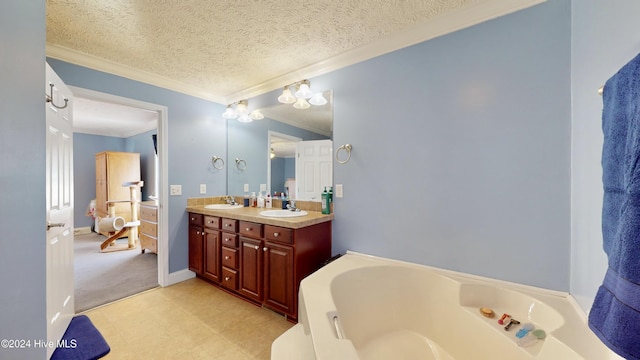 bathroom featuring vanity, a bath, a textured ceiling, and ornamental molding