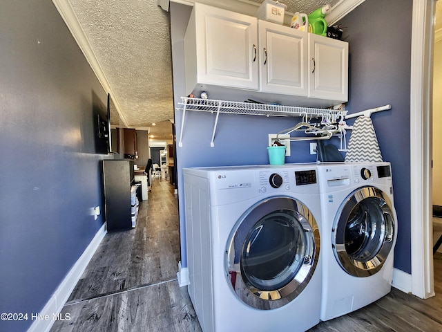 laundry area with crown molding, dark hardwood / wood-style flooring, a textured ceiling, and independent washer and dryer