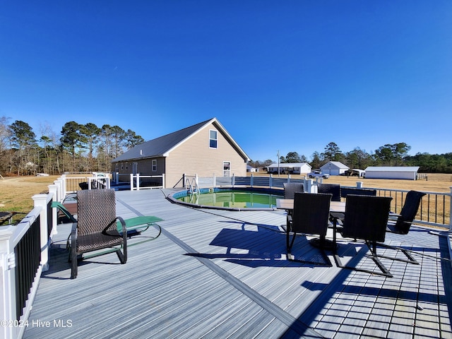 deck with a fenced in pool