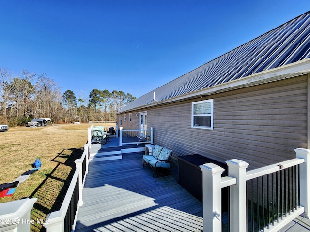 deck with an outdoor hangout area and a yard