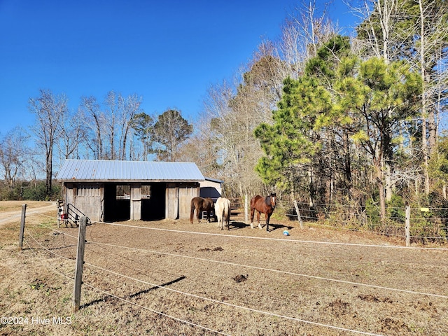 view of outbuilding with a rural view