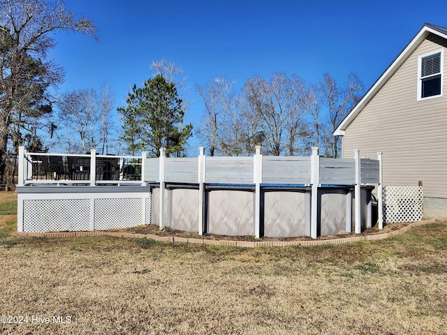 view of yard featuring a pool side deck