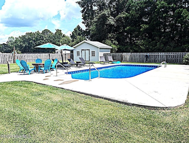 526 Rock Creek Dr N, Jacksonville, NC 28540 - view of pool featuring a patio area, view of scattered trees, and an outbuilding