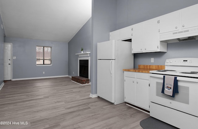 kitchen featuring a brick fireplace, white appliances, light hardwood / wood-style flooring, white cabinets, and lofted ceiling