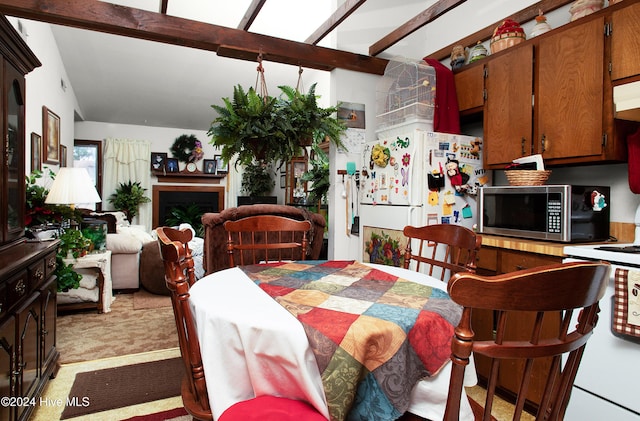 dining room featuring lofted ceiling