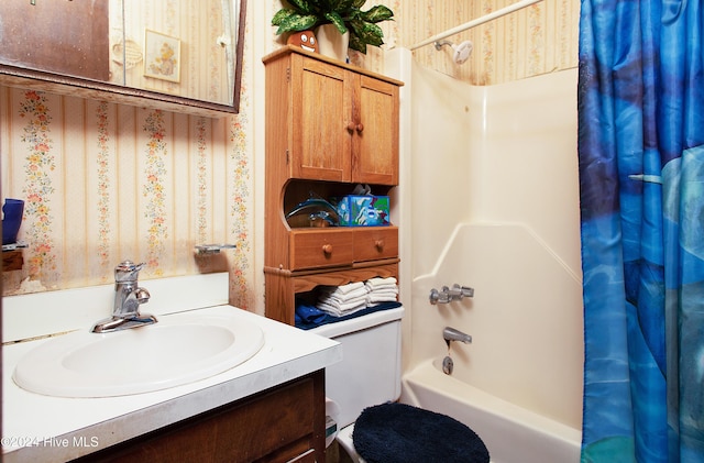 full bathroom featuring shower / bath combo, vanity, and toilet