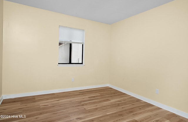 unfurnished room with light hardwood / wood-style floors