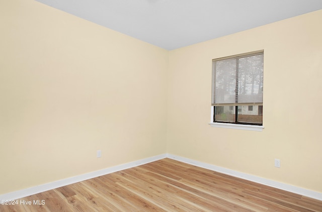 empty room with wood-type flooring