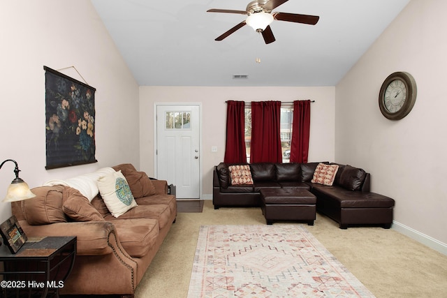 living room featuring ceiling fan, light carpet, and plenty of natural light