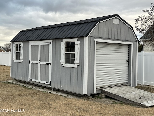 view of outdoor structure with a lawn