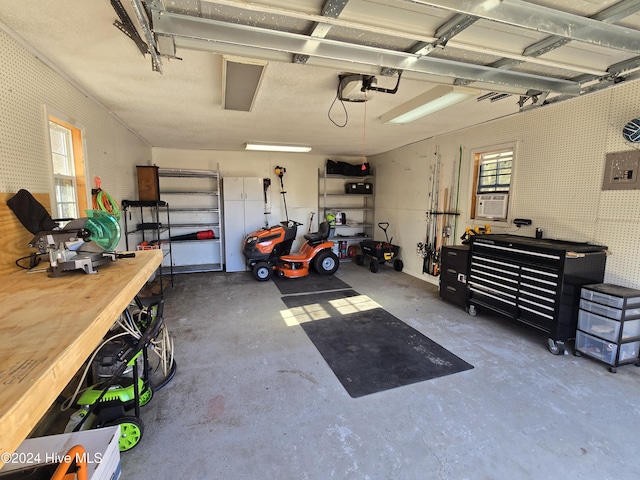 garage with electric panel and a garage door opener