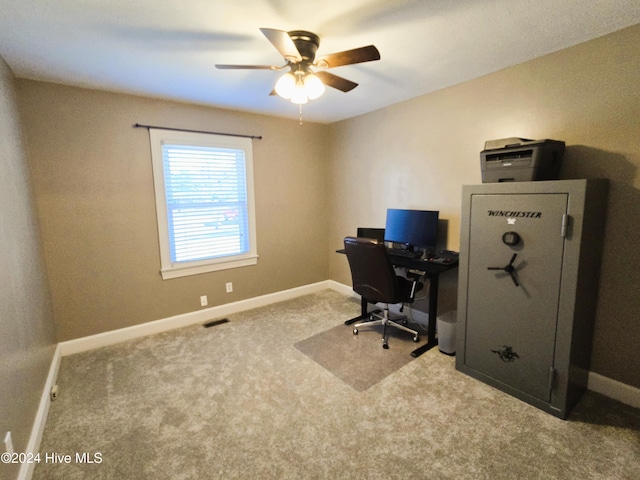 carpeted office with ceiling fan