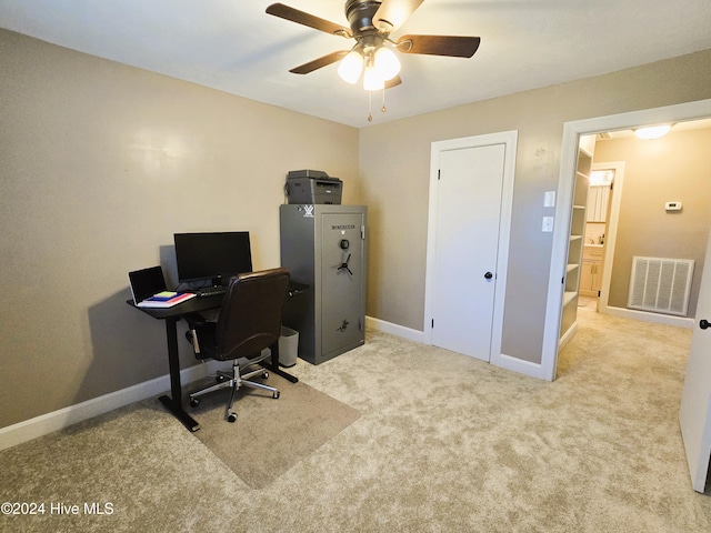 carpeted office with ceiling fan