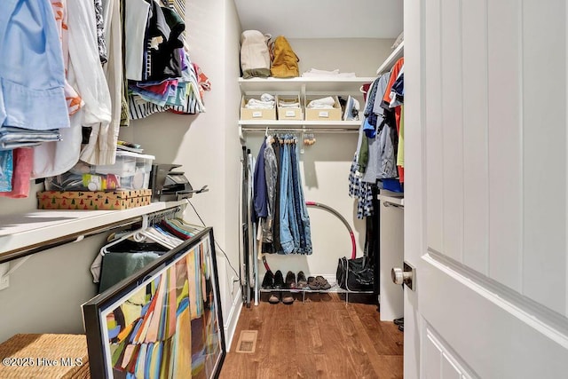 spacious closet featuring hardwood / wood-style flooring