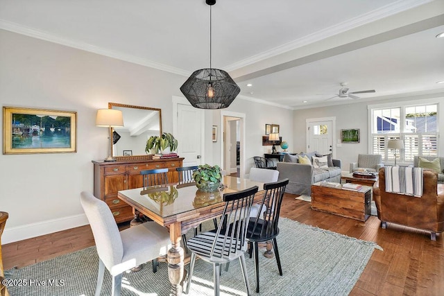 dining area featuring hardwood / wood-style flooring, ceiling fan, and ornamental molding