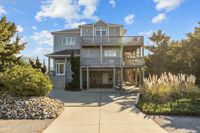 coastal home with a balcony and a carport