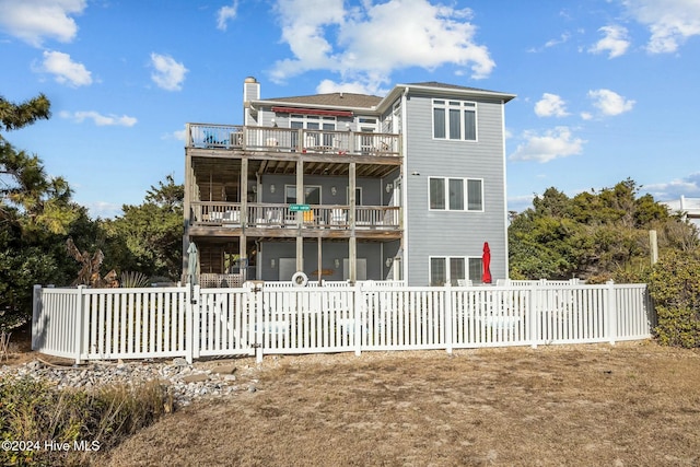 back of house with a balcony