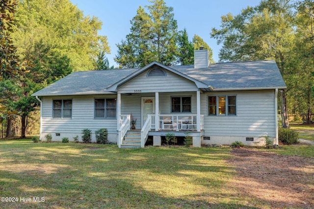 view of front of house featuring a porch and a front lawn