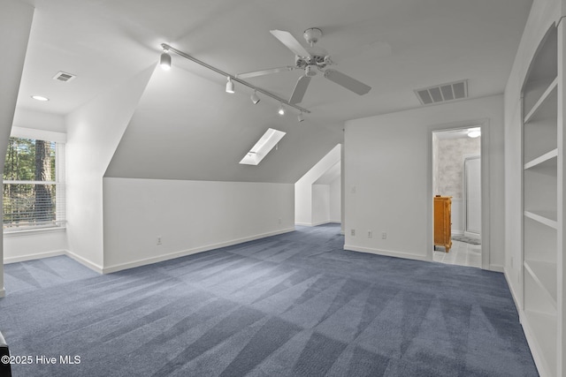 7 Brinyan Ct, Pinehurst, NC 28374 - bonus room with carpet flooring, baseboards, a skylight, a ceiling fan, and vaulted ceiling