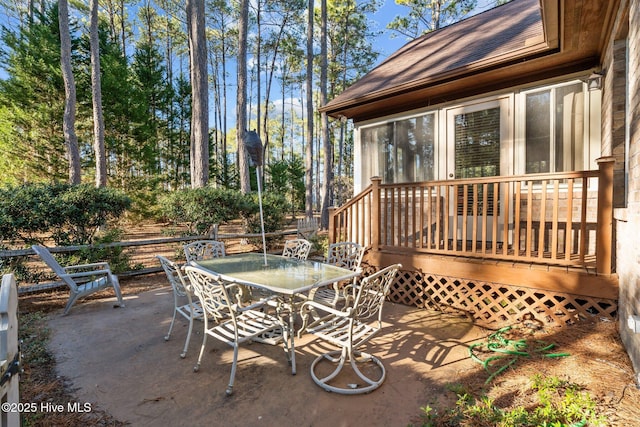 7 Brinyan Ct, Pinehurst, NC 28374 - view of patio with outdoor dining area and a wooden deck