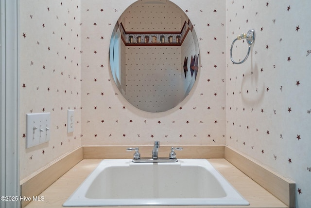 7 Brinyan Ct, Pinehurst, NC 28374 - bathroom featuring a sink and wallpapered walls