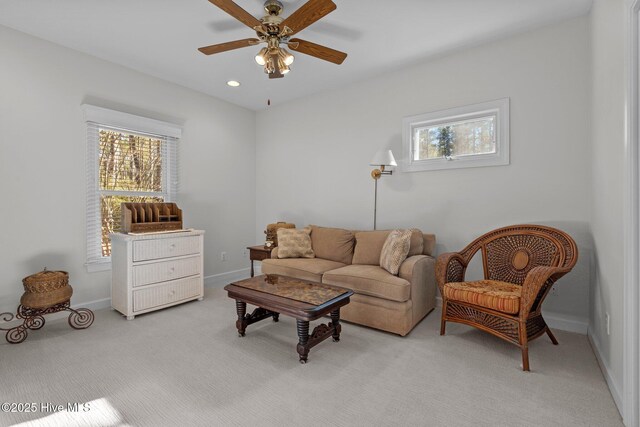 7 Brinyan Ct, Pinehurst, NC 28374 - living area with light carpet, a ceiling fan, and baseboards