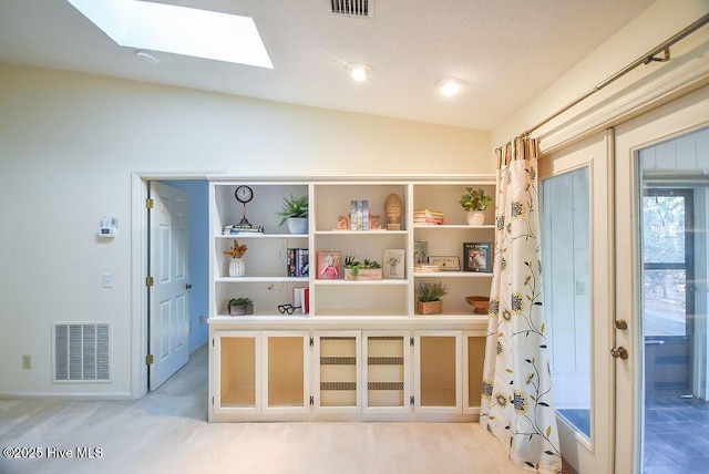 kitchen with ornamental molding and appliances with stainless steel finishes