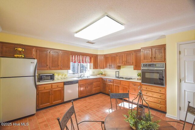 carpeted spare room with ceiling fan and crown molding